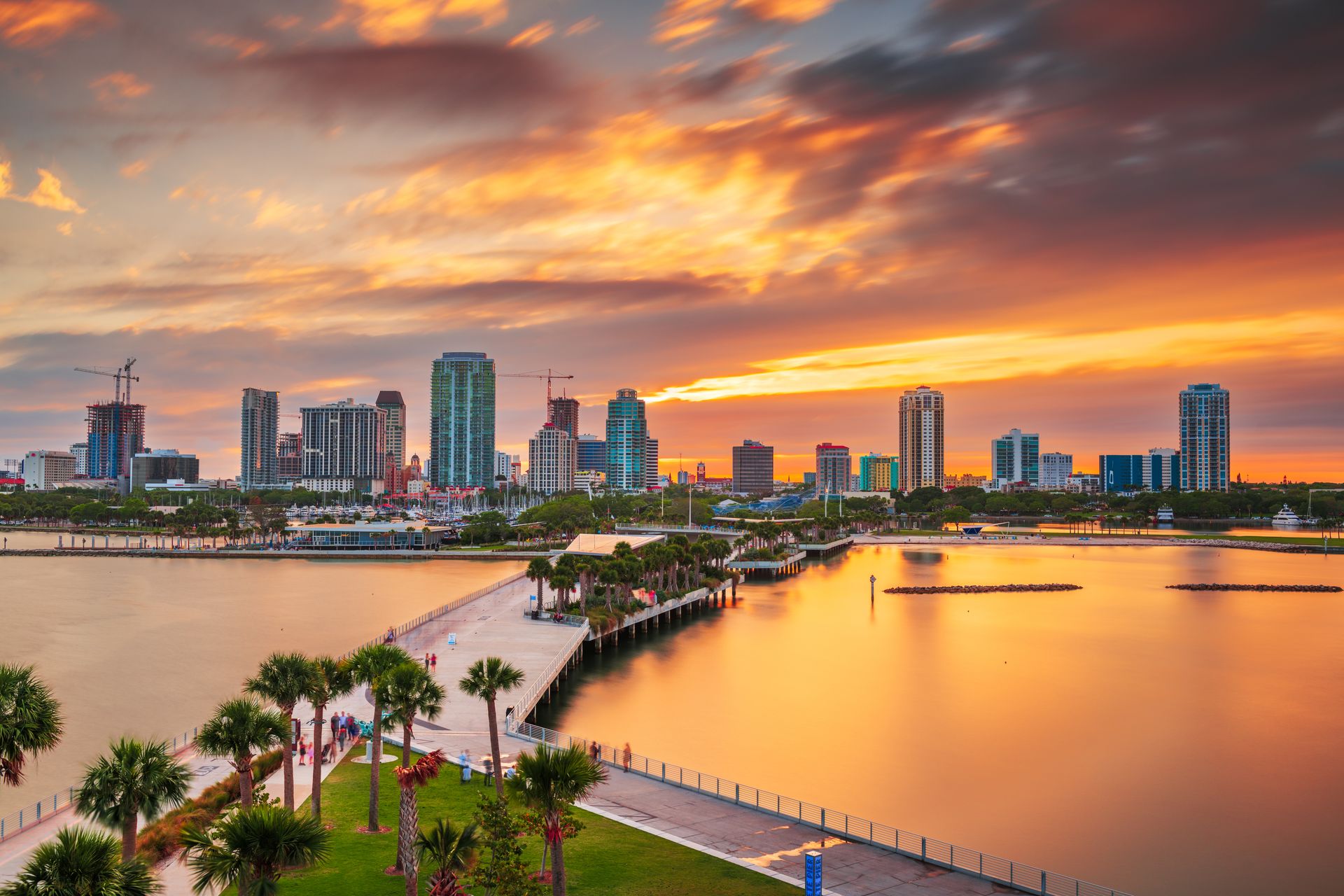 St. Petersburg skyline and palm-lined waterfront at sunset